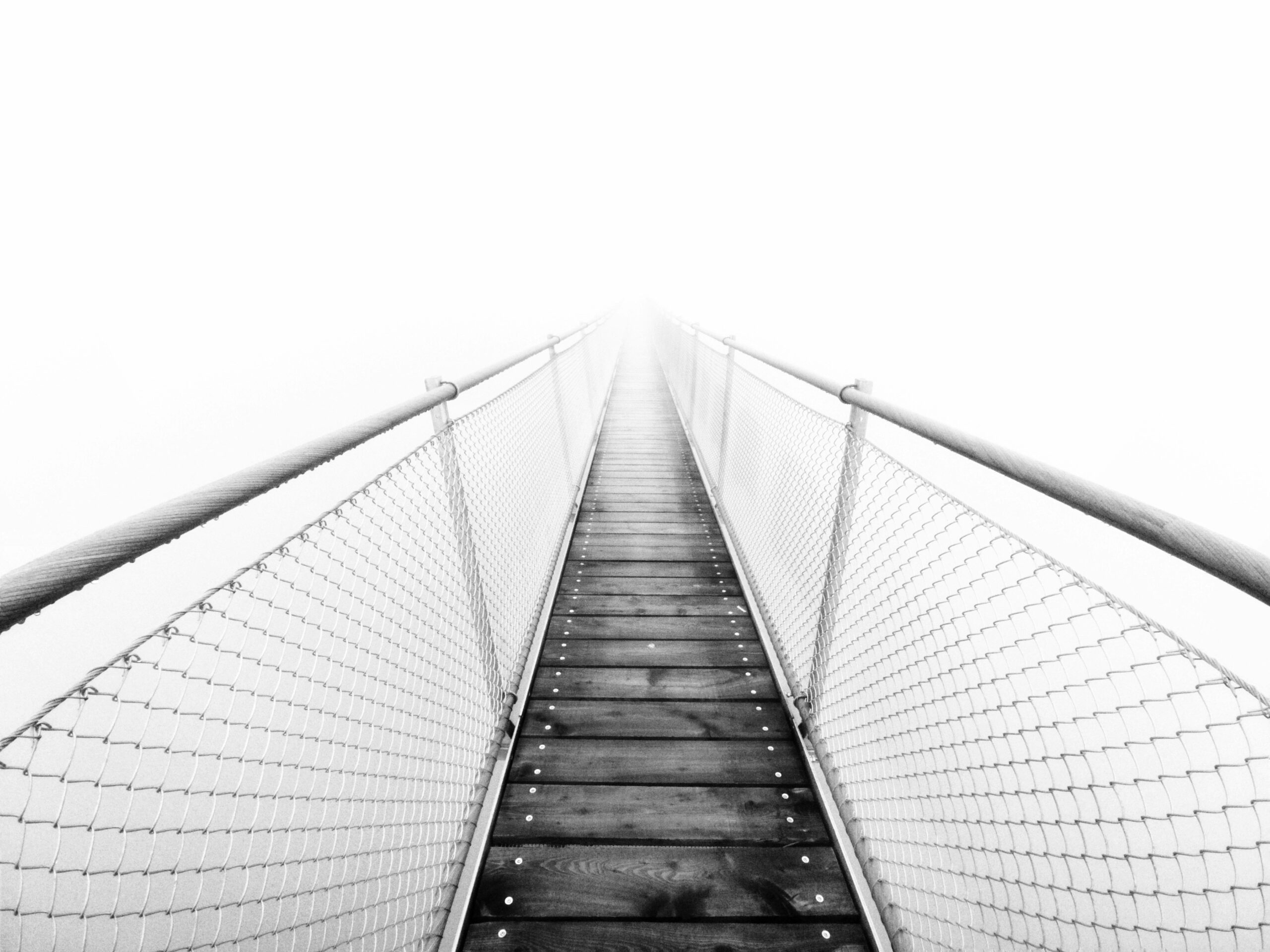 Courage in everyday life, showing a suspended bridge representing taking bold steps toward growth and overcoming fear.